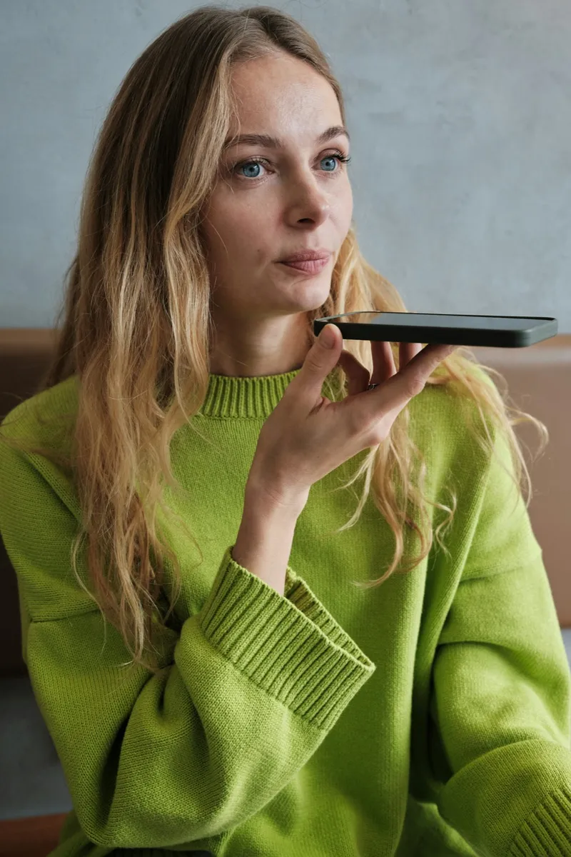 A person speaking on a phone call at home